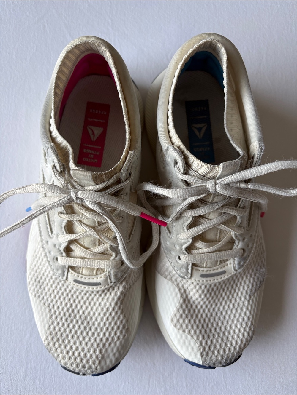 Reebok Off-White Sneakers with Pink and Blue Accents